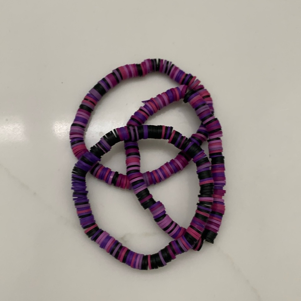 Three purple bracelets